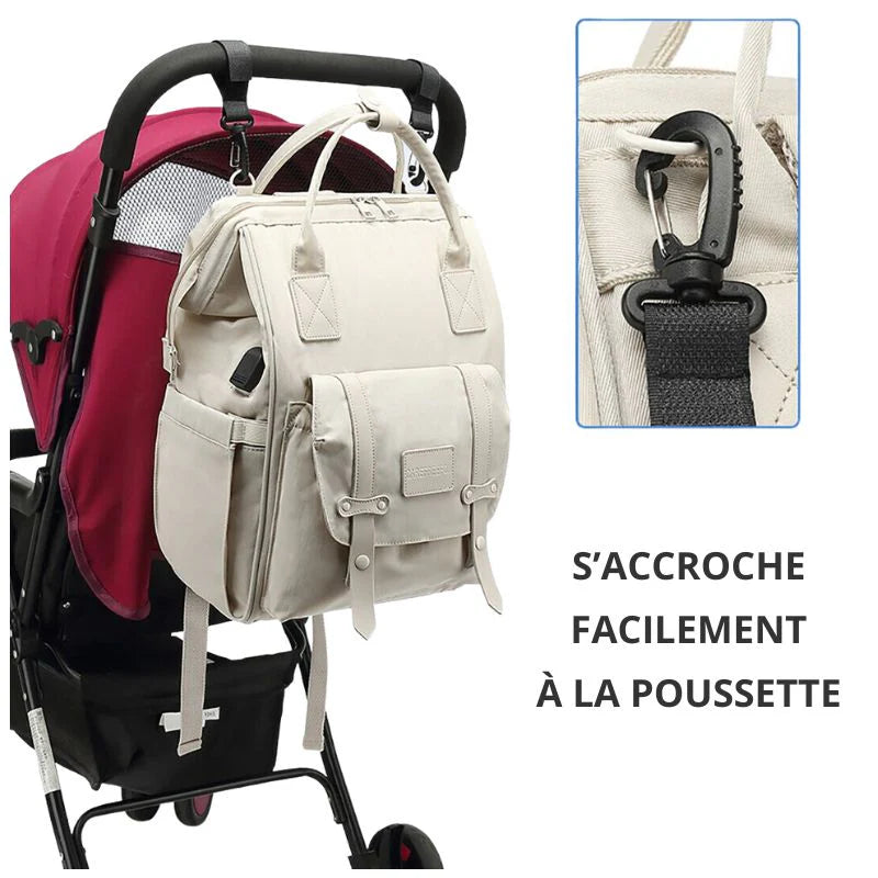 Sac à langer Nora™ fixé à une poussette grâce aux crochets intégrés