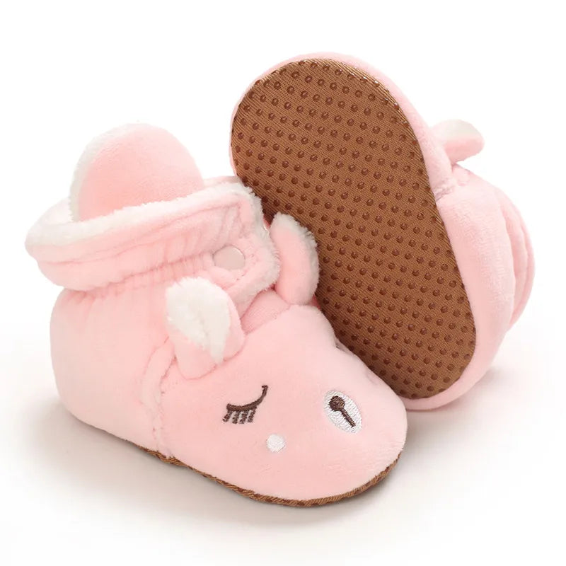 Semelle souple à picots des chaussons bébé de Noël fourrés