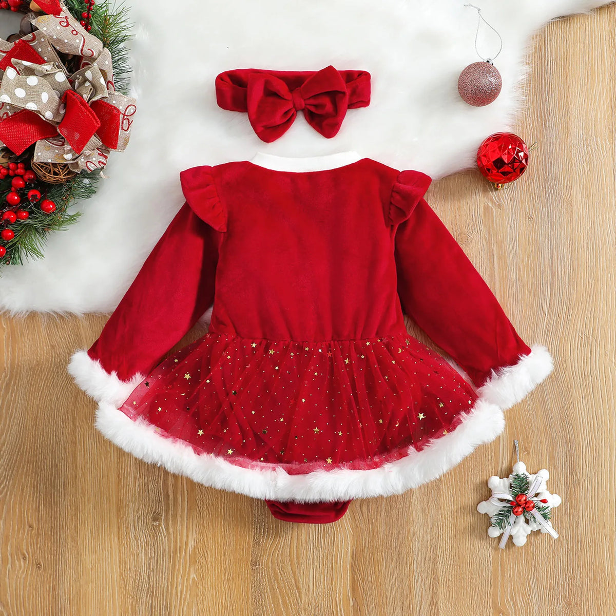Robe barboteuse bébé Noël rouge effet velours, tutu à étoiles dorées et bordures en fausse fourrure