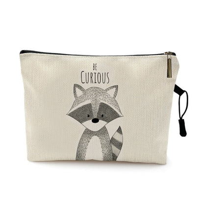 Trousse de voyage bébé à motif animal coloris raton laveur