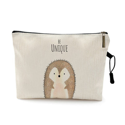 Trousse de voyage bébé à motif animal coloris hérisson