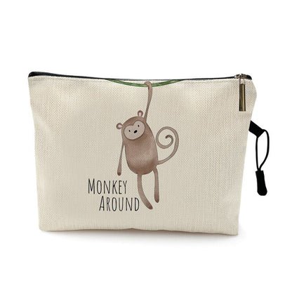Trousse de voyage bébé à motif animal coloris singe