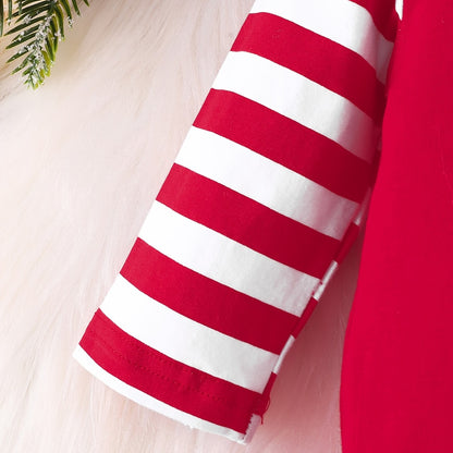 Manche rayée rouge et blanche de la combinaison bébé premier Noël